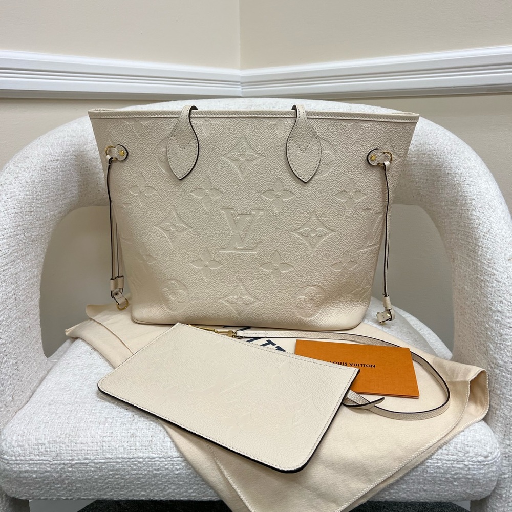 Louis Vuitton Neverfull MM Empreinte leather color cream